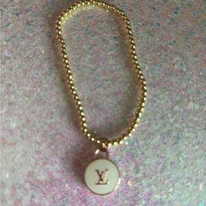 Gold Beaded Bracelet with White Charm